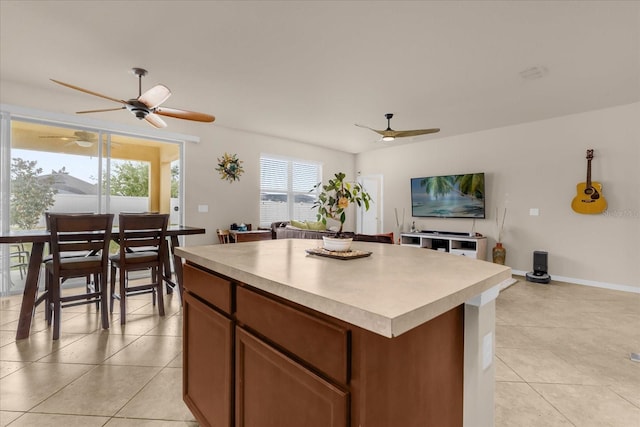 kitchen featuring a kitchen island and light tile patterned flooring