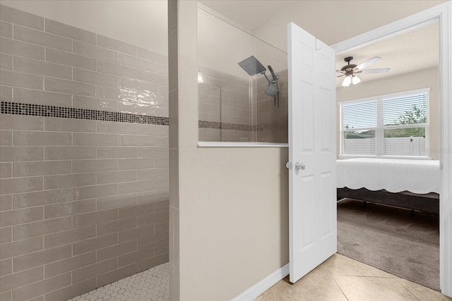 bathroom featuring tiled shower, tile patterned floors, and ceiling fan