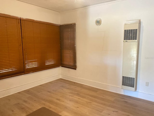 unfurnished room featuring hardwood / wood-style floors