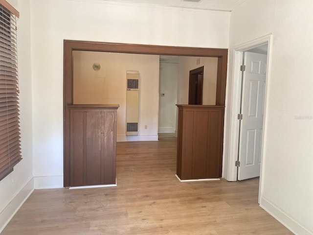 corridor featuring light hardwood / wood-style floors