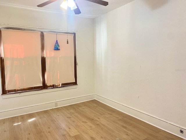 spare room featuring ceiling fan and hardwood / wood-style floors