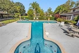 view of pool featuring a patio