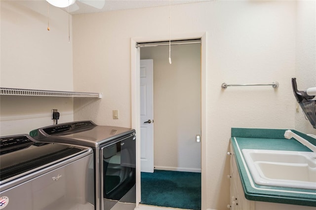 laundry area featuring attic access, carpet flooring, a sink, a ceiling fan, and washer and dryer