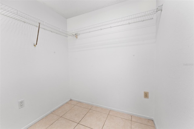 walk in closet featuring light tile patterned floors