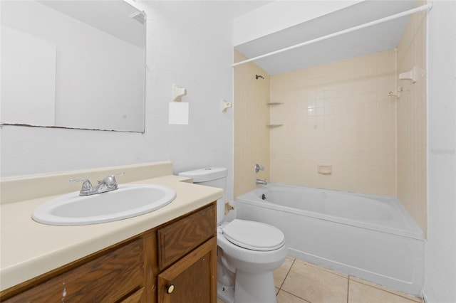 full bathroom featuring tile patterned floors, tiled shower / bath combo, toilet, and vanity