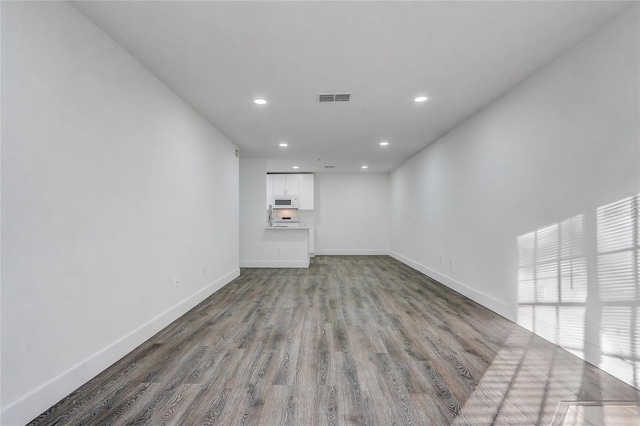 empty room with wood-type flooring