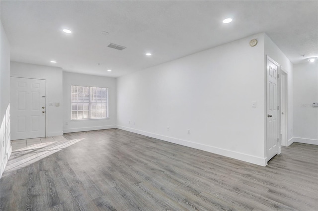 unfurnished living room with light wood-type flooring