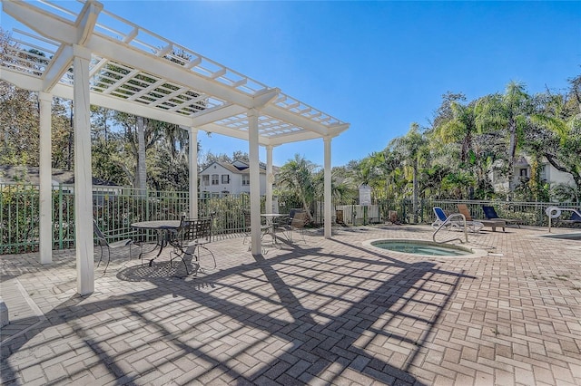 view of patio / terrace featuring a pergola and a hot tub