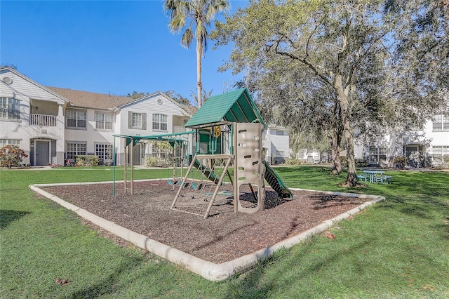 view of jungle gym with a lawn