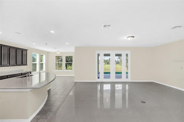 interior space featuring french doors and sink