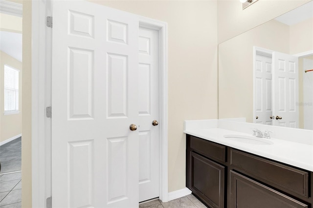 bathroom with tile patterned flooring and vanity