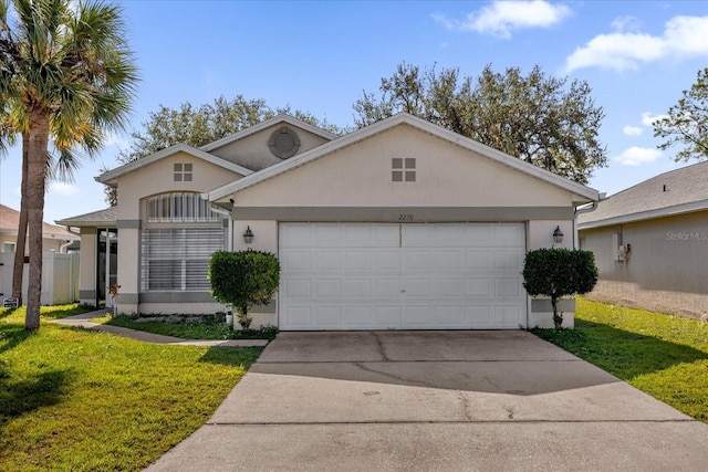 view of front of home with a garage and a front lawn