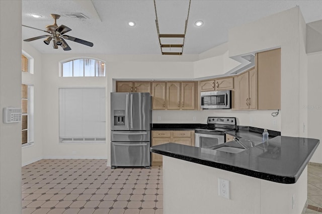 kitchen with sink, ceiling fan, light brown cabinetry, kitchen peninsula, and stainless steel appliances