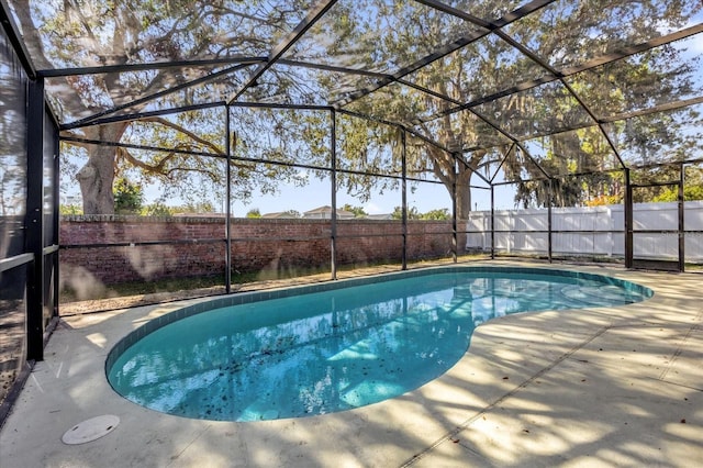 view of pool featuring a lanai and a patio