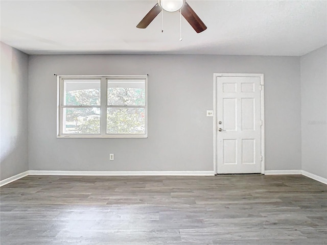 unfurnished room featuring hardwood / wood-style flooring and ceiling fan