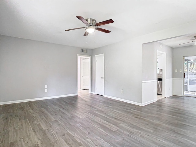 spare room featuring hardwood / wood-style floors and ceiling fan