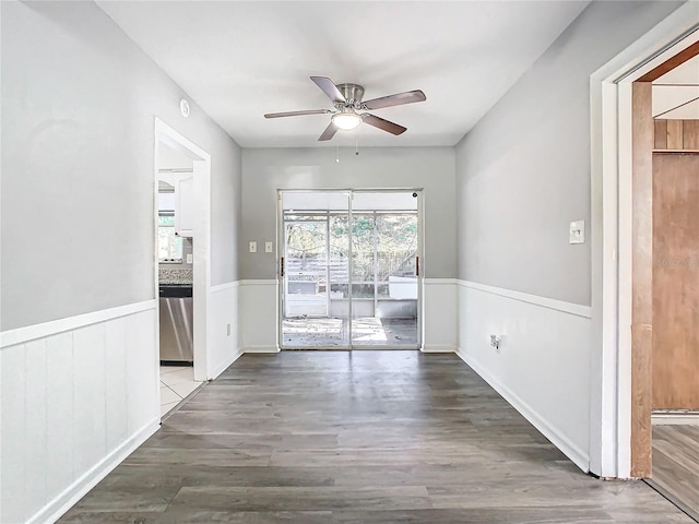 spare room featuring hardwood / wood-style floors and ceiling fan