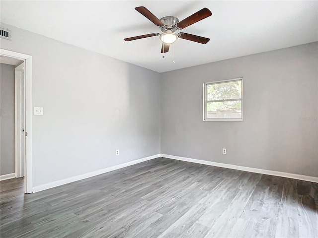 unfurnished room with ceiling fan and hardwood / wood-style flooring