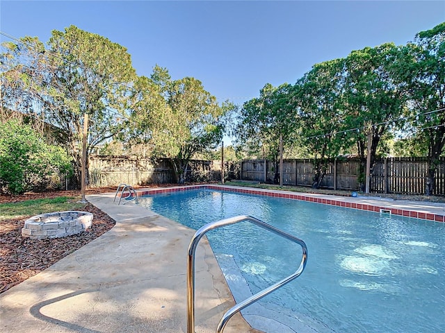 view of pool featuring a fire pit