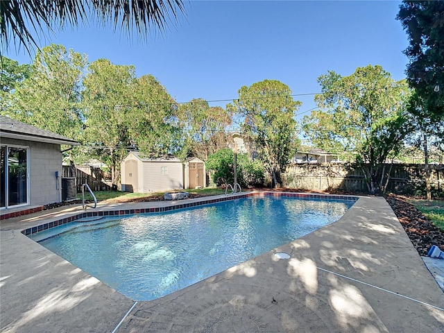 view of pool with a storage unit