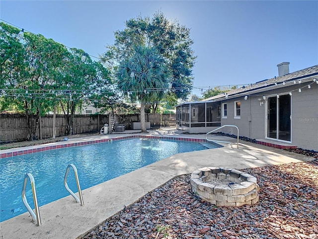 view of pool featuring an outdoor fire pit