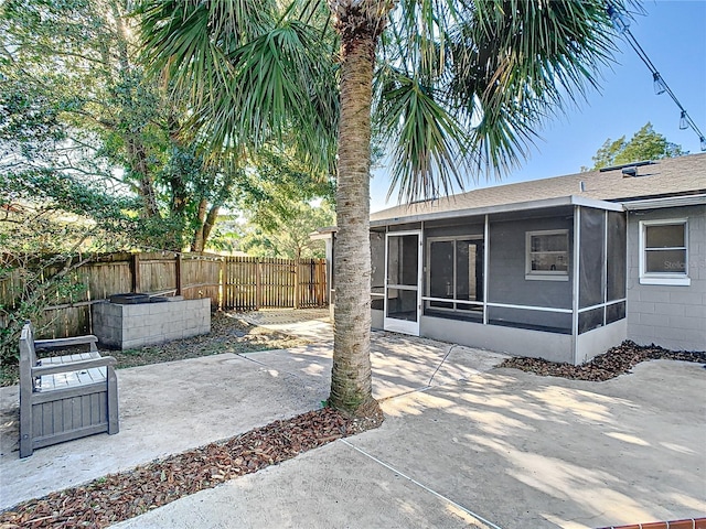 view of patio with a sunroom