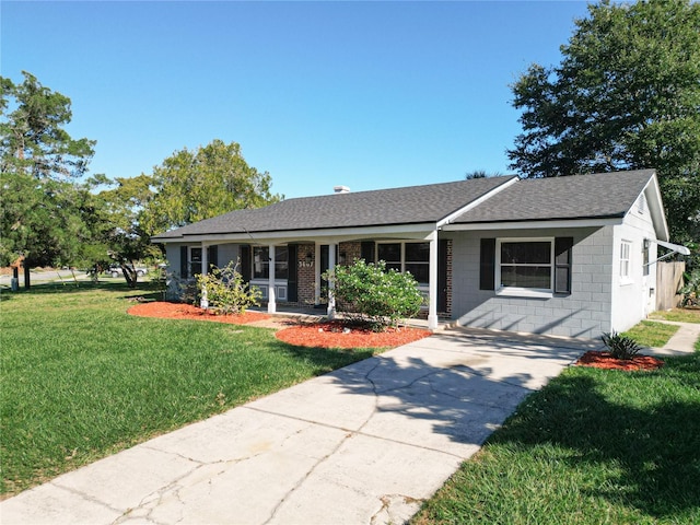 ranch-style house with a front lawn