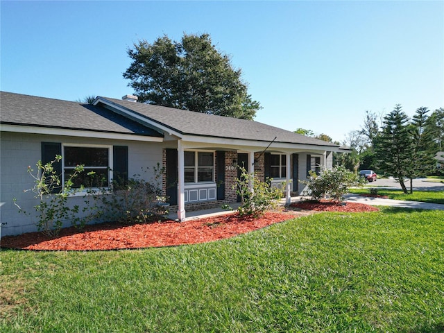 ranch-style house with a porch and a front yard