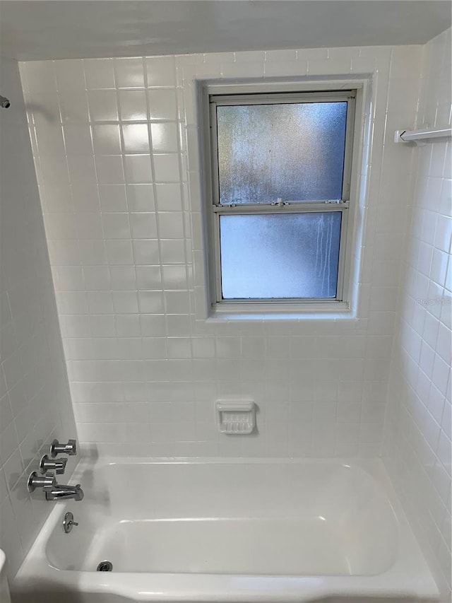 bathroom with shower / bathing tub combination