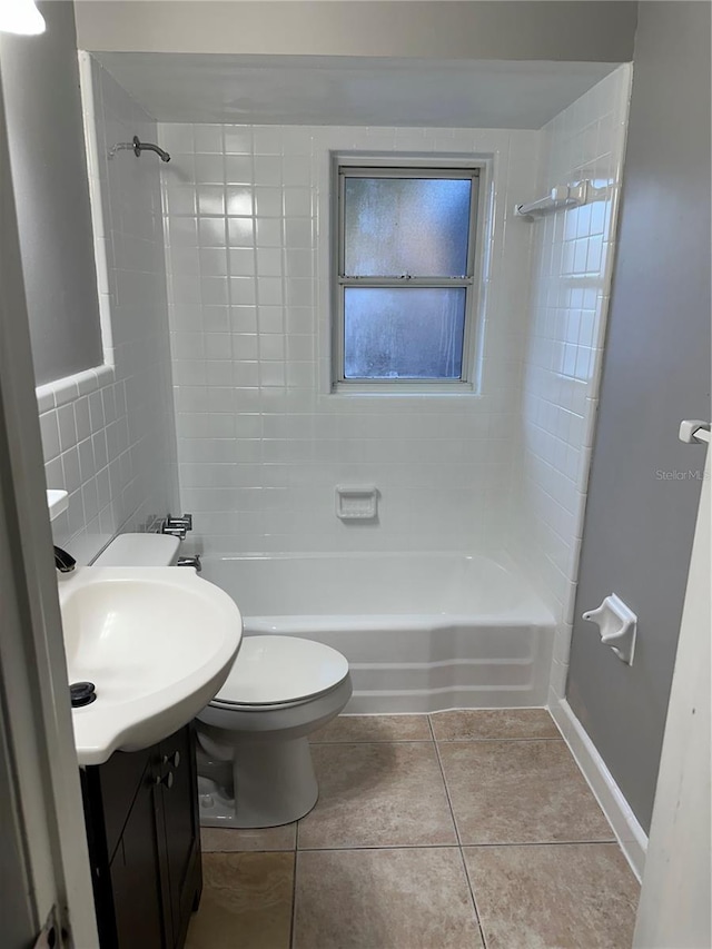 full bath featuring toilet, shower / tub combination, vanity, and tile patterned floors