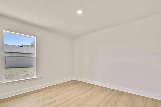 empty room with light wood-type flooring