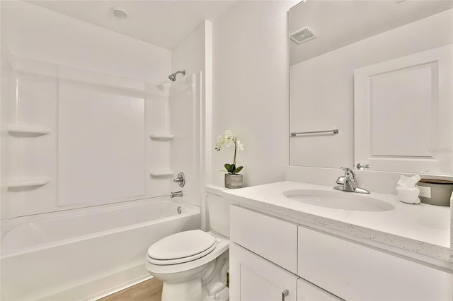 full bathroom featuring vanity, shower / bathtub combination, toilet, and wood-type flooring