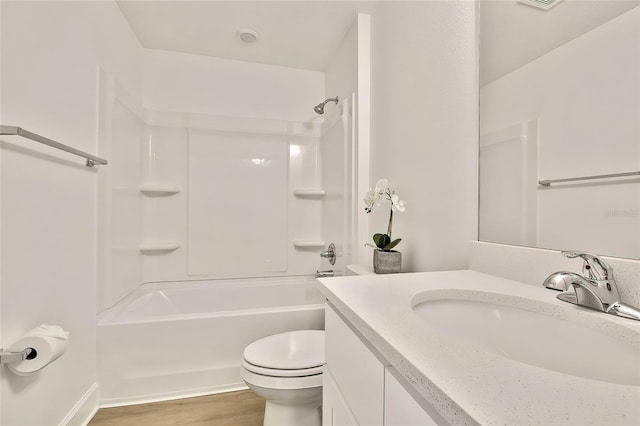 full bathroom with hardwood / wood-style flooring, vanity, toilet, and tub / shower combination