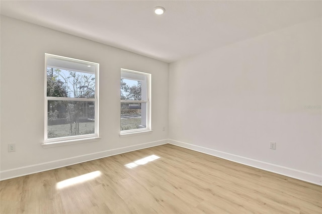 unfurnished room featuring light hardwood / wood-style flooring