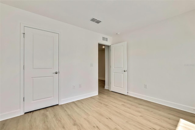 unfurnished bedroom featuring light wood-type flooring