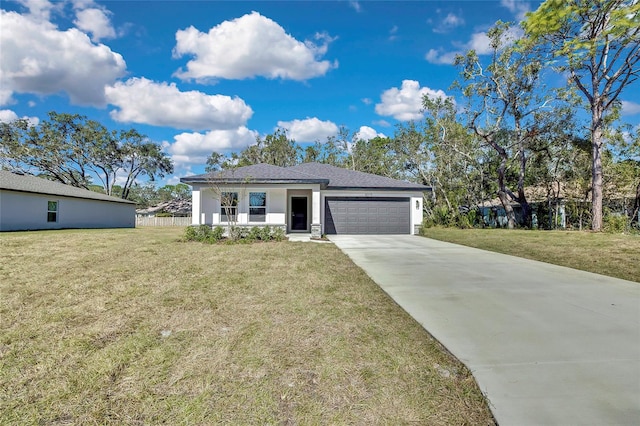 view of front facade with a garage and a front yard