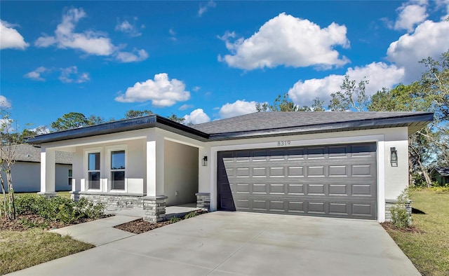 view of front of property with a garage