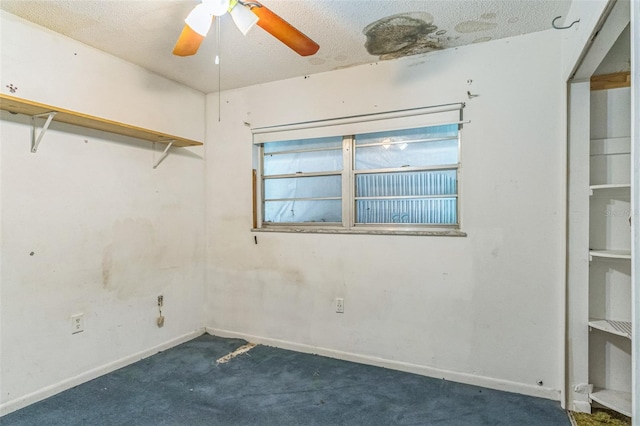 carpeted spare room featuring a textured ceiling