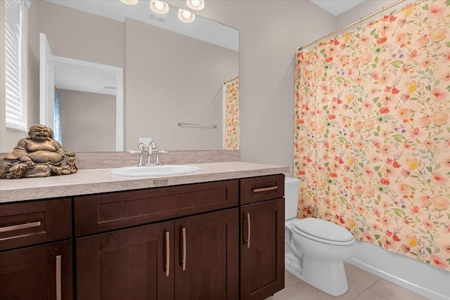 full bathroom with tile patterned flooring, shower / bath combination with curtain, vanity, and toilet