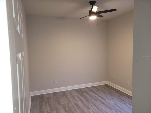 spare room featuring ceiling fan and wood-type flooring