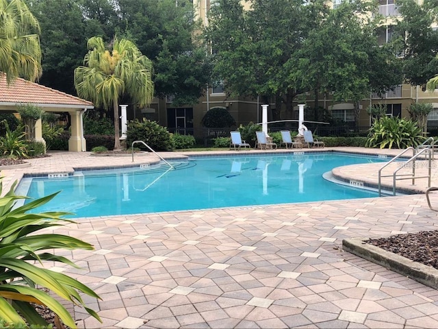 view of swimming pool featuring a patio