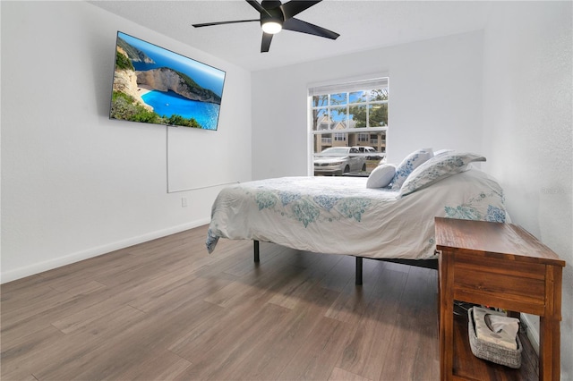 bedroom featuring ceiling fan and wood-type flooring