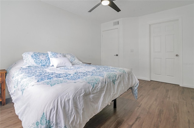 bedroom featuring ceiling fan and wood-type flooring