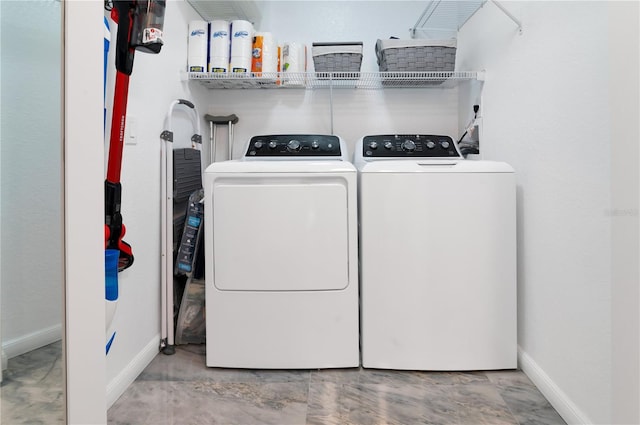 washroom featuring washer and dryer