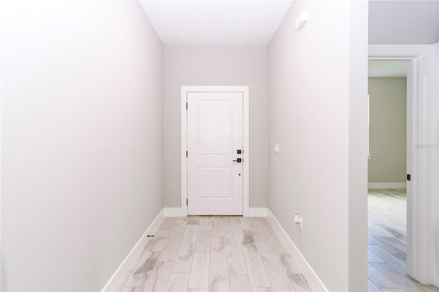 doorway to outside with light hardwood / wood-style flooring