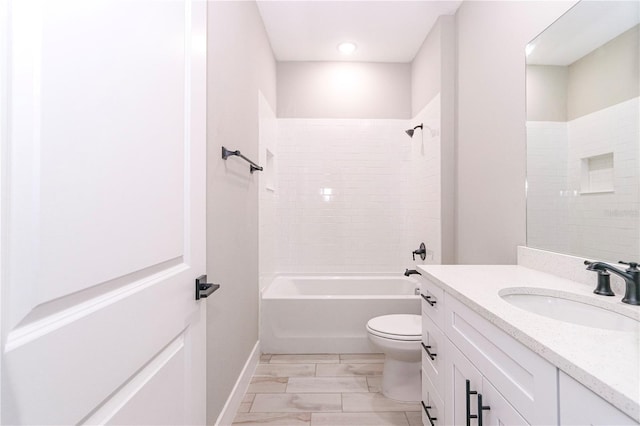 full bathroom featuring vanity, toilet, and tiled shower / bath