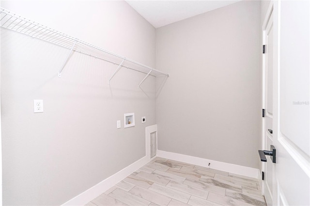 laundry room featuring electric dryer hookup, light wood-type flooring, and hookup for a washing machine