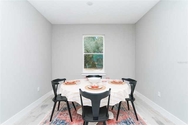 dining room with light hardwood / wood-style flooring