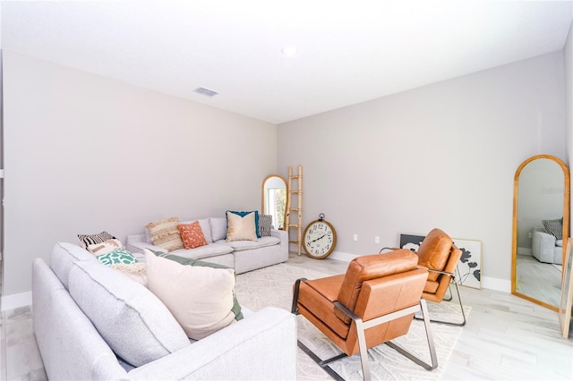 living room with light hardwood / wood-style floors