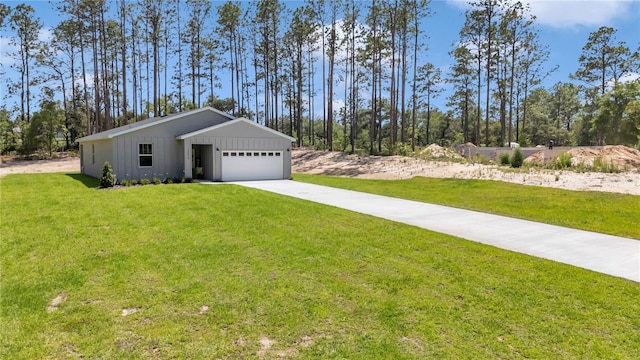13516 SW 78th Pl, Dunnellon, FL 34432 - view of front facade with board and batten siding, a front yard, driveway, and a garage